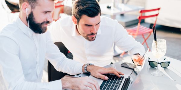 two-businessmen-outdoor-using-technology-1.jpg
